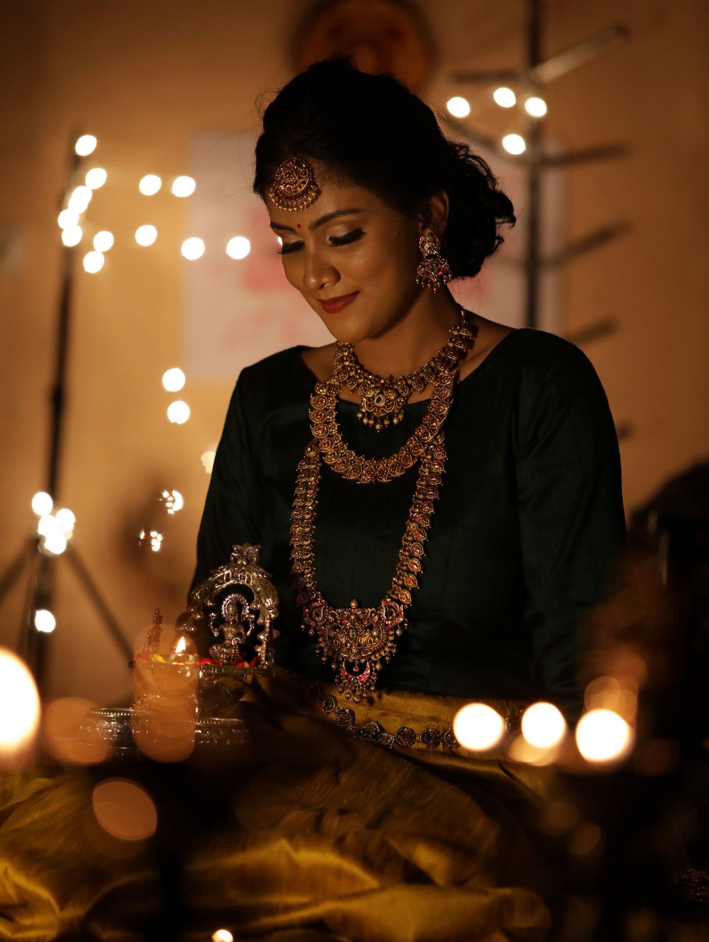 Dark green full sleeves blouse and beige color lehenga